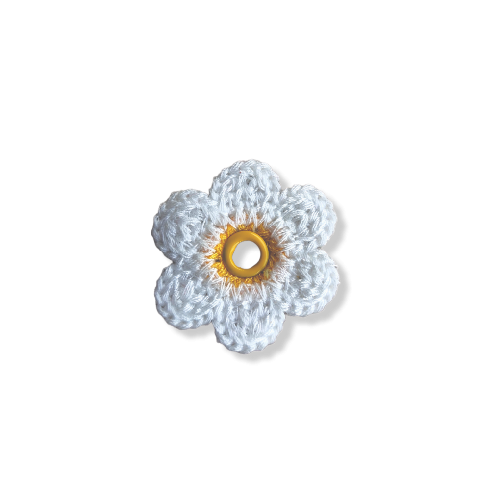 Crocheted white daisy with yellow centre